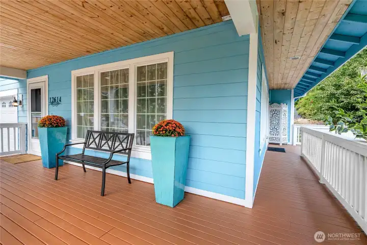 The front porch that wraps around towards the back sliding glass door.