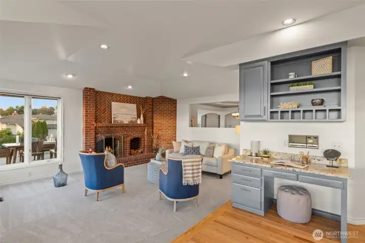 Family room with fireplace off kitchen.