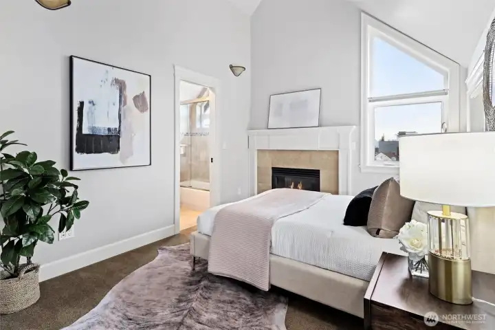 The primary bedroom is one of two en suite bedrooms on the upper level.