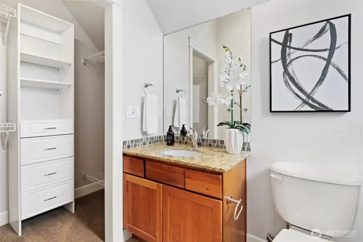 En suite bath for second upper level bedroom.