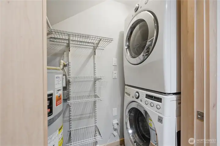 Laundry/storage room off main entry for convenience.