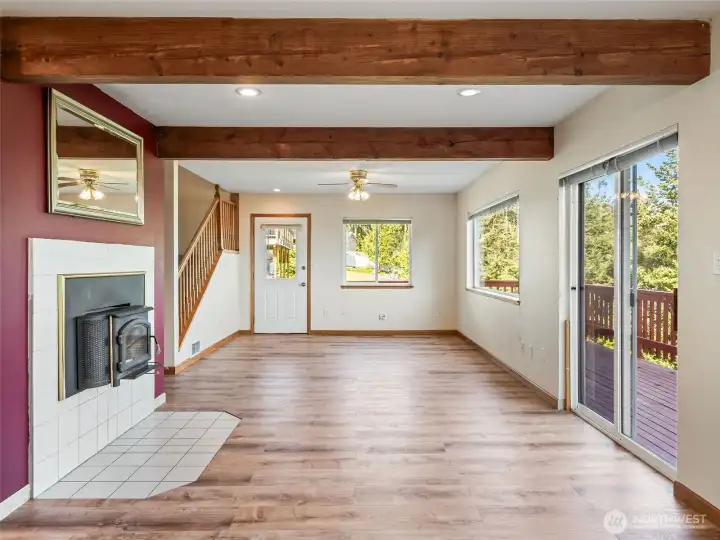 Wood stove on left, door to deck on right.