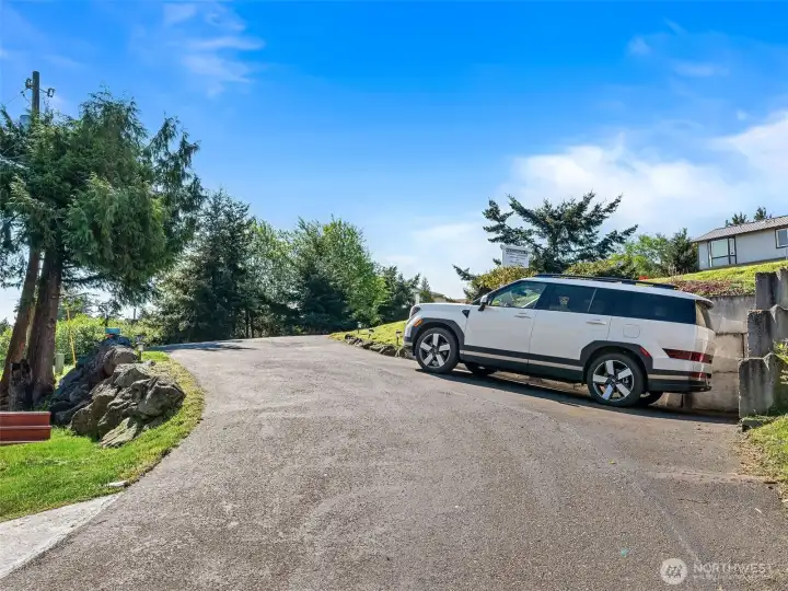 Parking spot along driveway & two more at bottom of driveway.