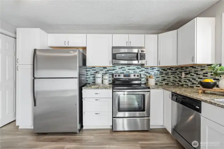 Chefs can move with ease in this open kitchen space and enjoy all the ample cabinetry storage space.