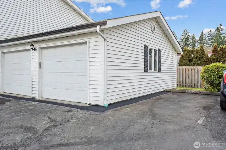 Such a delightful convenience of having a secured parking garage, additional storage space and a designated parking space. Parking is also allowed in front of the detached garage for additional parking.