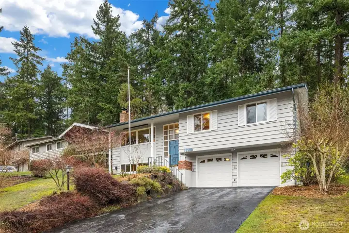 Well-located home set back on a gently sloped lot, blending classic architecture with a quiet, residential setting.