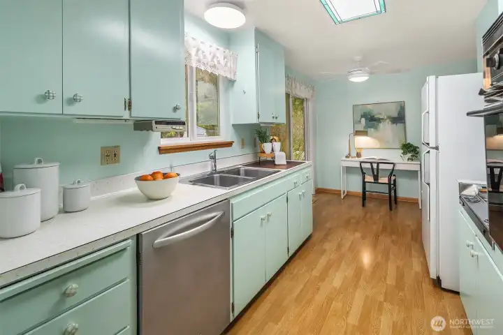 Sunny kitchen with classic character, comfortable proportions, and room to personalize at your own pace.