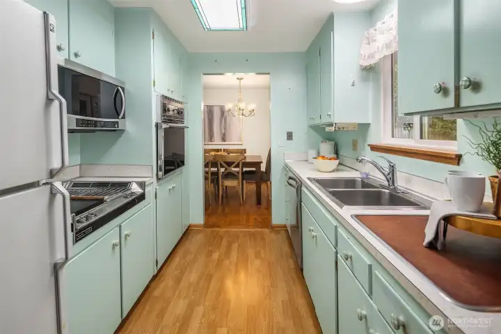 Well-sized kitchen with a functional footprint and natural light, offering a strong opportunity for thoughtful updates and customization.