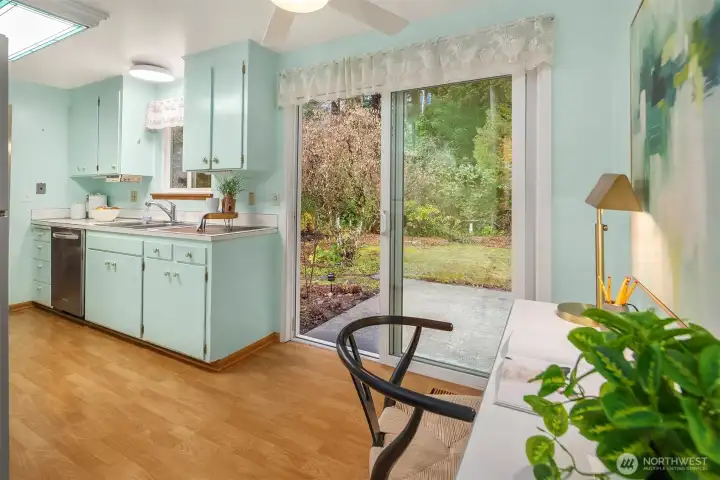 Sunny kitchen with an indoor-outdoor connection—ideal for shared meals, casual entertaining, and time spent together.