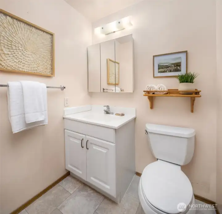 Functional powder room located off of the primary bedroom.