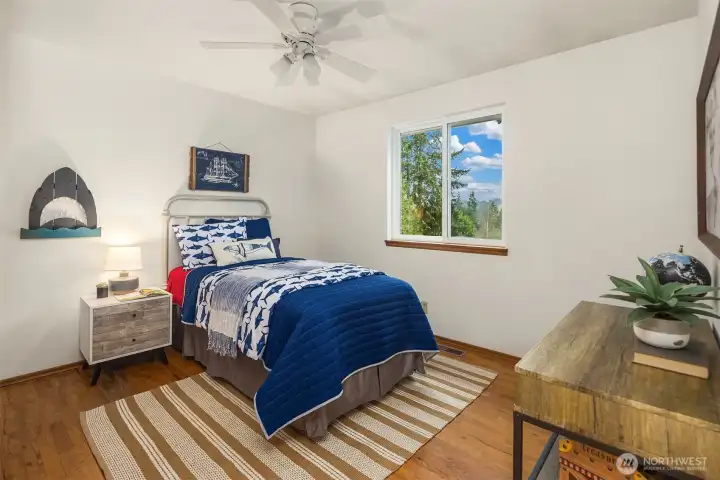 Well-sized third bedroom with natural light and versatile use options.