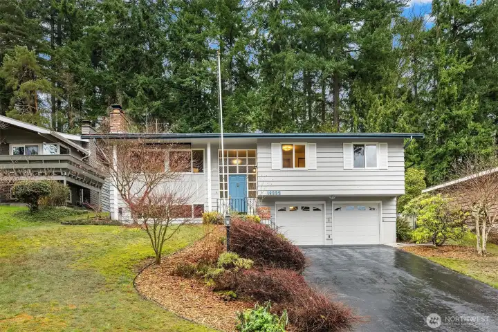 Two-car garage and generous driveway add everyday functionality and ease of living.