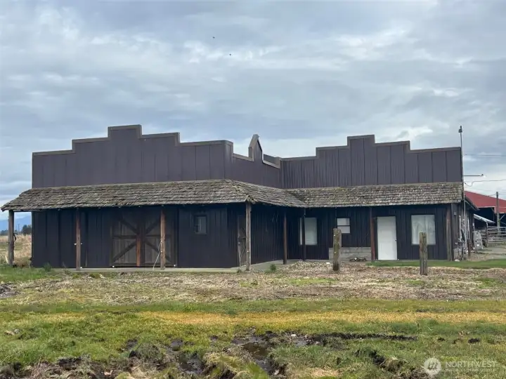 This building has box stalls and potential additional living space.