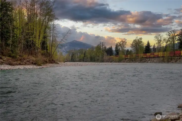 Stunning riverfront acreage ~ positioned OUT of the flood plain yet offers direct river access.