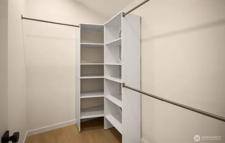 Custom built-in shelving in the walk-in closet