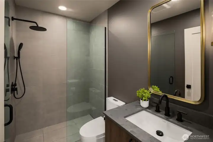The secondary bathroom retains the luxury finish and feel found throughout the rest of the home