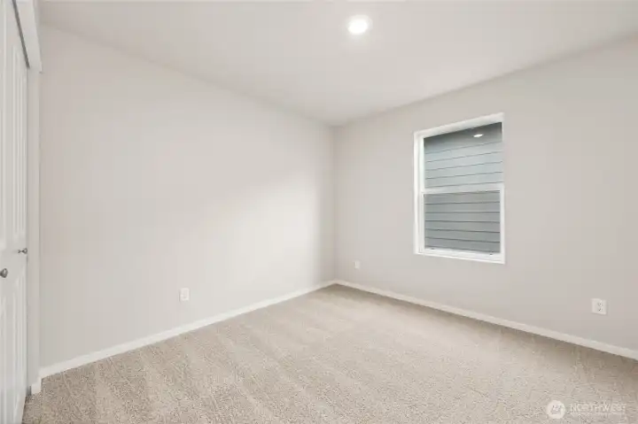 Generously sized secondary bedroom. Photos are representative only and may display different color packages and/or upgrades.