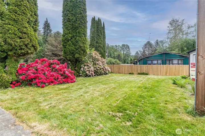 Lush and mature landscaping provides front yard privacy.
