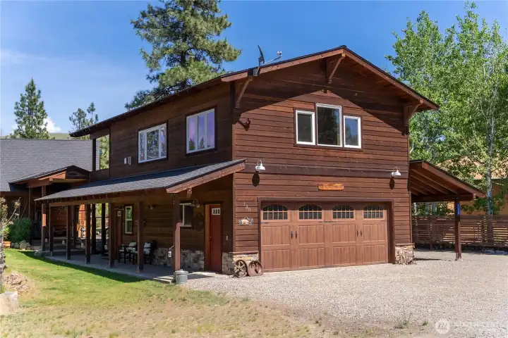 Welcome to 130 Sundown where in-town location meets the highly sought after secluded private feel. Street view towards detached garage with ADU above. Main home kitty-corner back to the left.