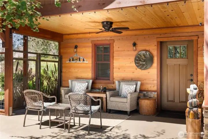 Custom iron detailing, covered seating directly outside of main entry
