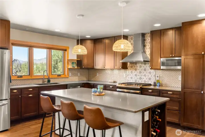 Main home kitchen, with kitchen window views peek-a-booing towards Spring Creek Ranch