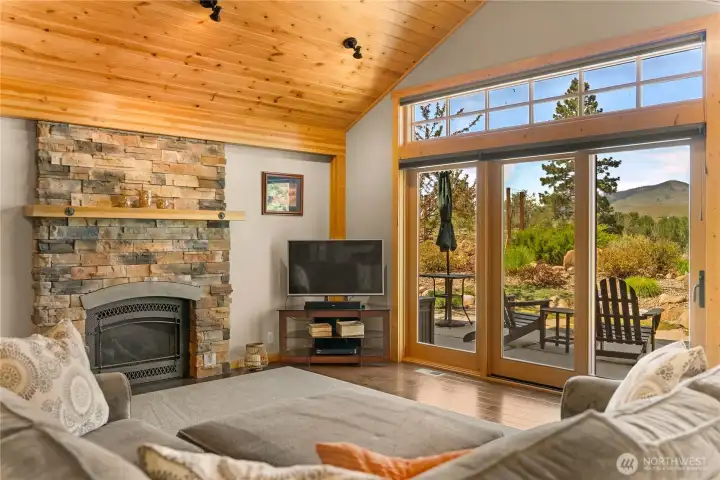 Stone and wood accents carry the outside in, offering a comfortable yet chic space to relax