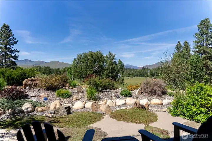 Step through the sliding glass doors to one of many intentional conversation areas and patios.