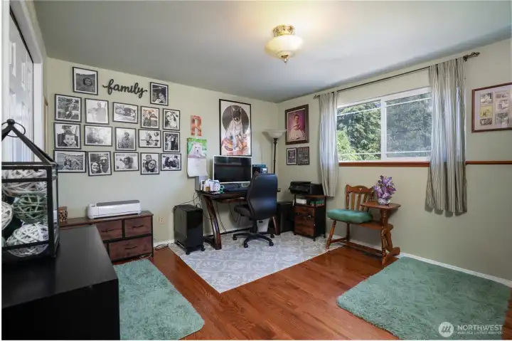 Heading to the other side of the home, we have the first of four goodsized bedrooms.  This one is currently used as an office.