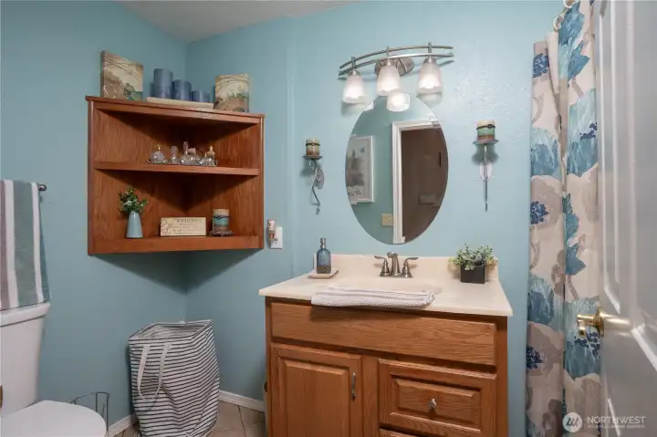 Located on the main floor, this full bath is centrally located between the 2 upper bedrooms.