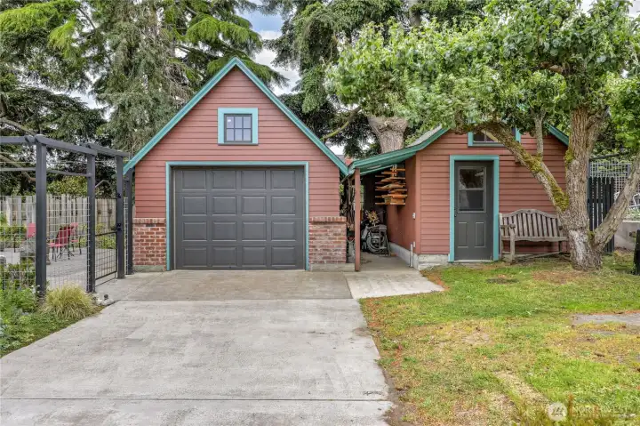 294 sq. ft. detached garage. (ask to see the inside photos) Garden shed on the right and close to the vegetable garden for storing all the garden equipment .
