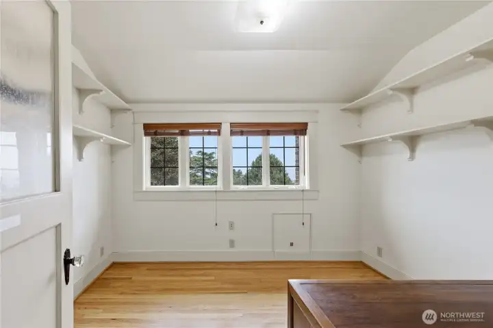 Den/office/library with a view and built-in shelves