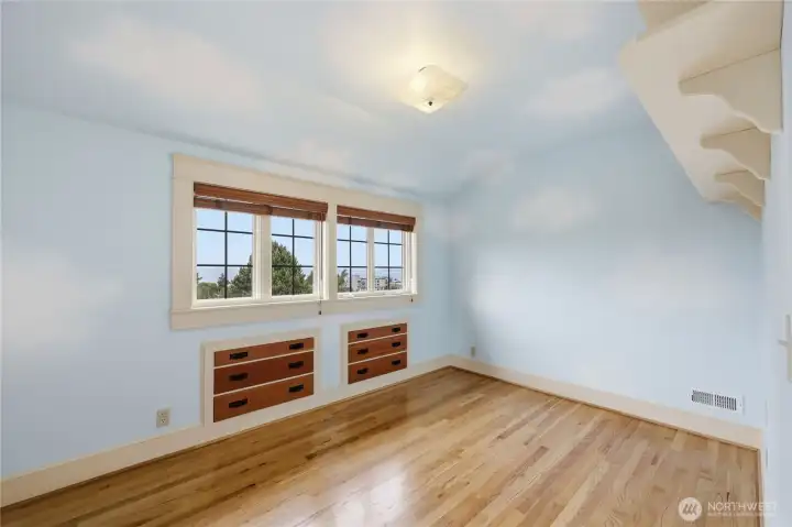 Third bedroom with built in drawers and shelves.