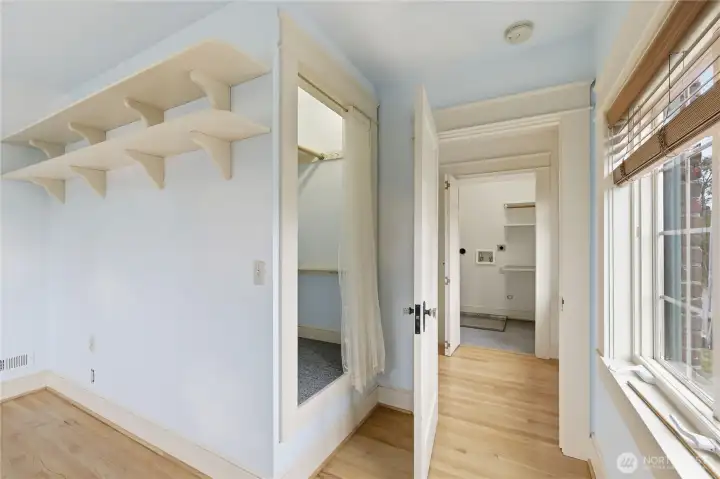 Entrance to the third bedroom, showing the closet and built-in shelving.
