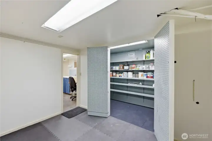 Exercise room and storage cabinet.
