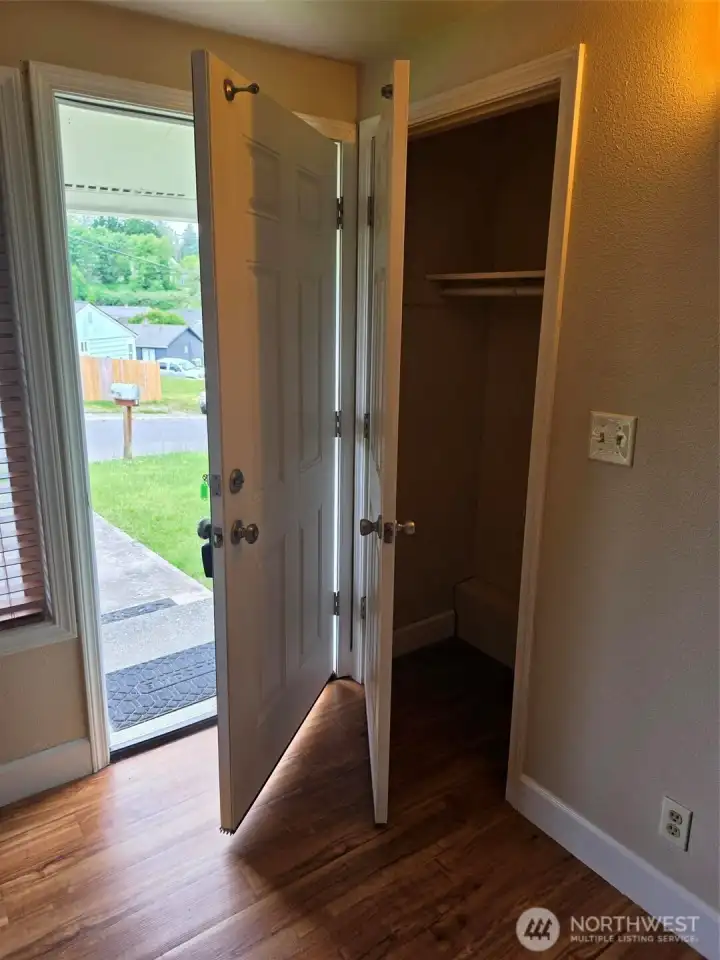 Front door with closet door to right