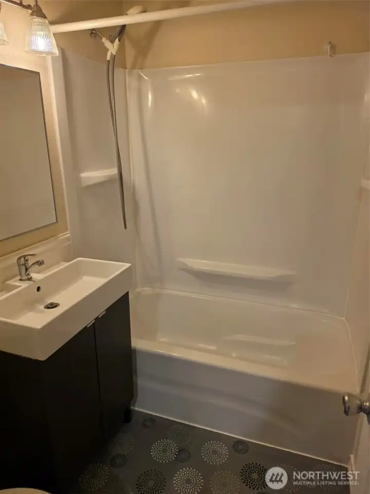 Bathroom with tub and shower