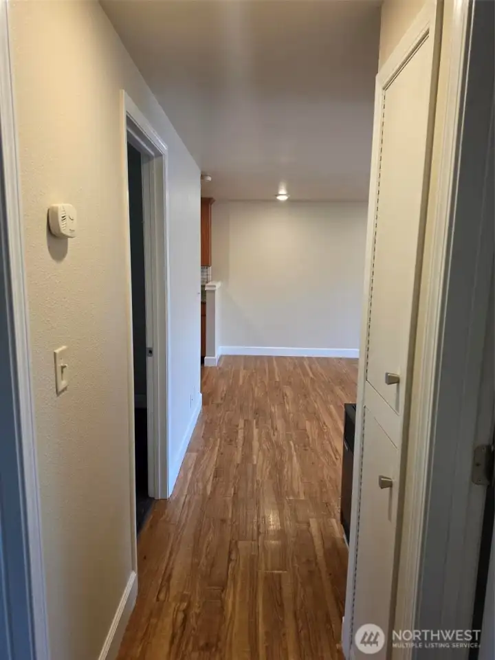 Hallway looking out to living room with bedrooms 2 & 3 to left