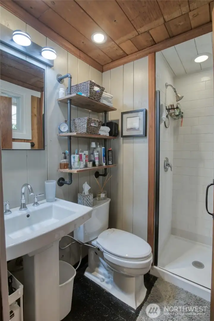 3/4 remodeled bathroom with a new tiled shower
