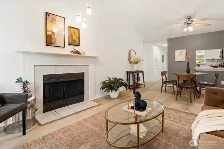 Warm and inviting living space with a wood-burning fireplace, perfect for relaxing or entertaining.