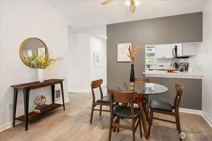 Inviting dining area with a pass-through kitchen that enhances convenience and conversation.