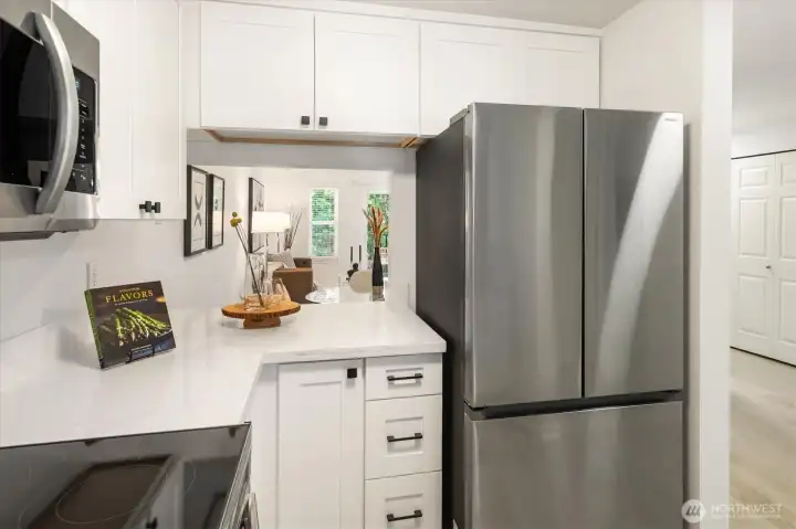Ample prep space, and sleek stainless steel fridge.