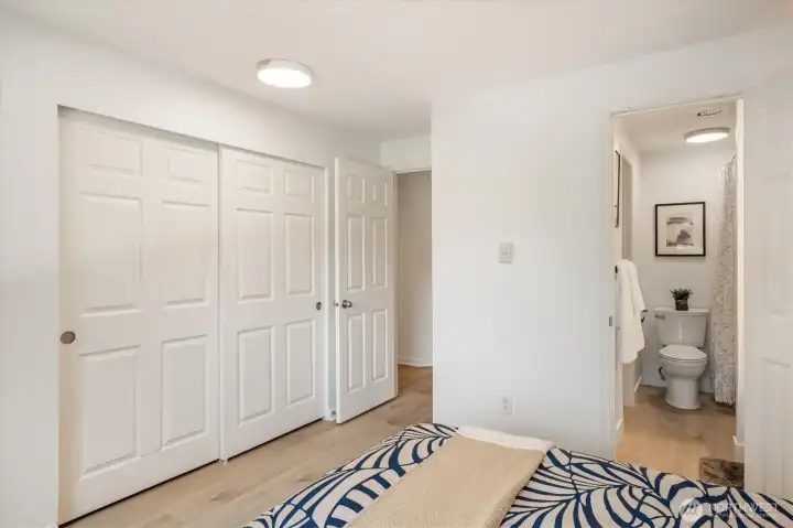 2nd primary bedroom has its own access to the shared hall bath and generous closet space.
