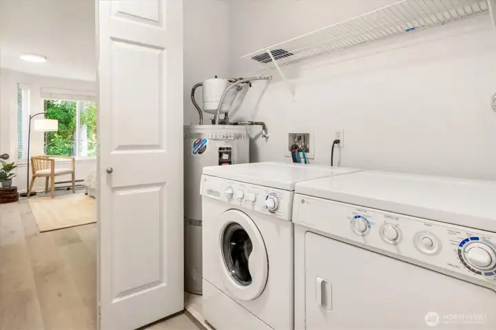 Convenient in-unit laundry with full-size washer and dryer and updated water tank for everyday ease.