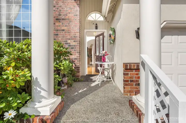 Covered & inviting front entry.