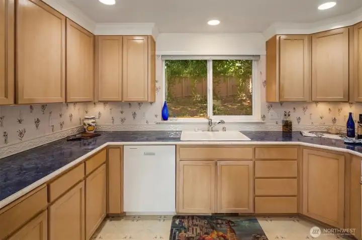 Spacious kitchen with ample counter and cabinet space.