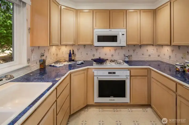 Spacious kitchen with ample counter & cabinet space.