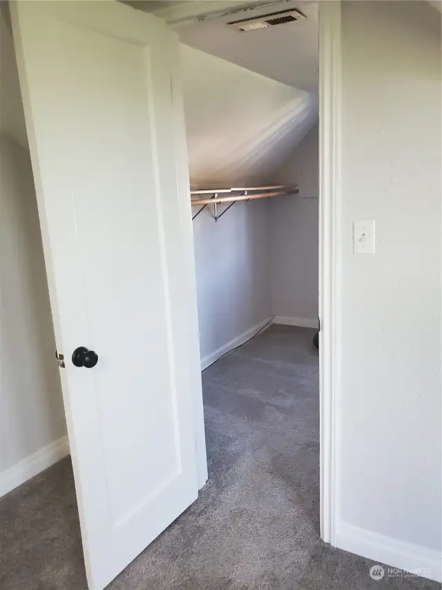 Bedroom 4 upstairs with walk in closet . Room is approximately 14 x 17 ft.