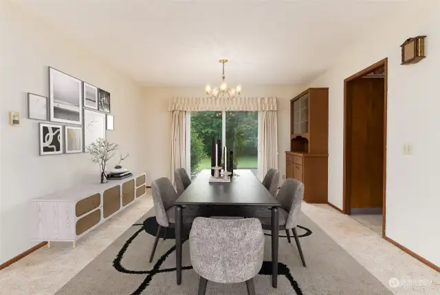 Dining room has plenty of space for a large table and chairs and includes the built-in cabinet on the right.