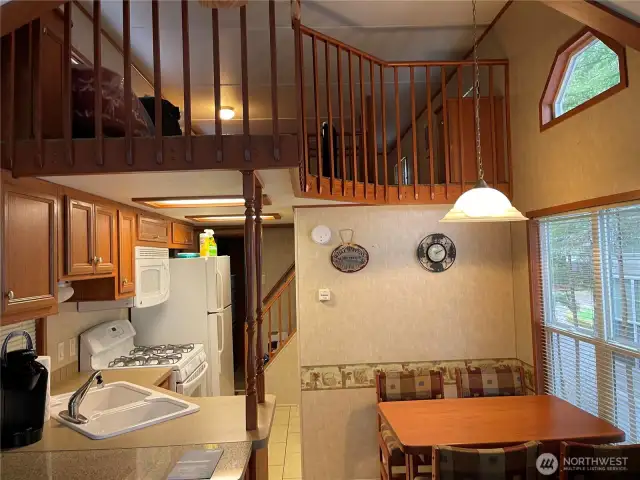Looking into the kitchen area. Open loft upstairs