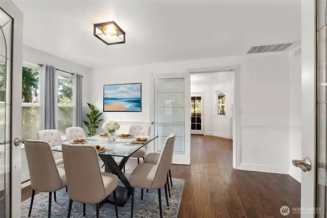 Formal dining room is intimate offering views of the side yard. Fresh paint throughout the home is crisp and refreshing.